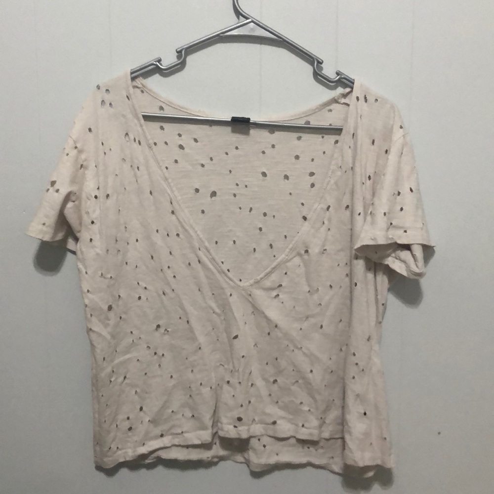 Deep V perforated tee